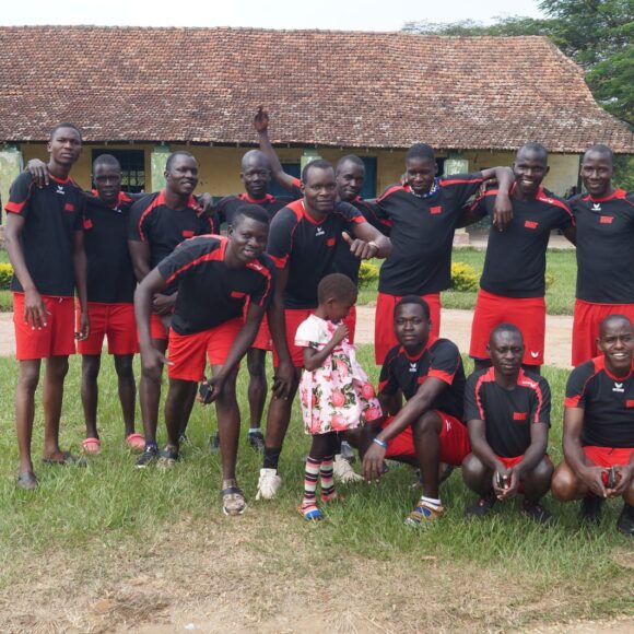 The football team in front of the school