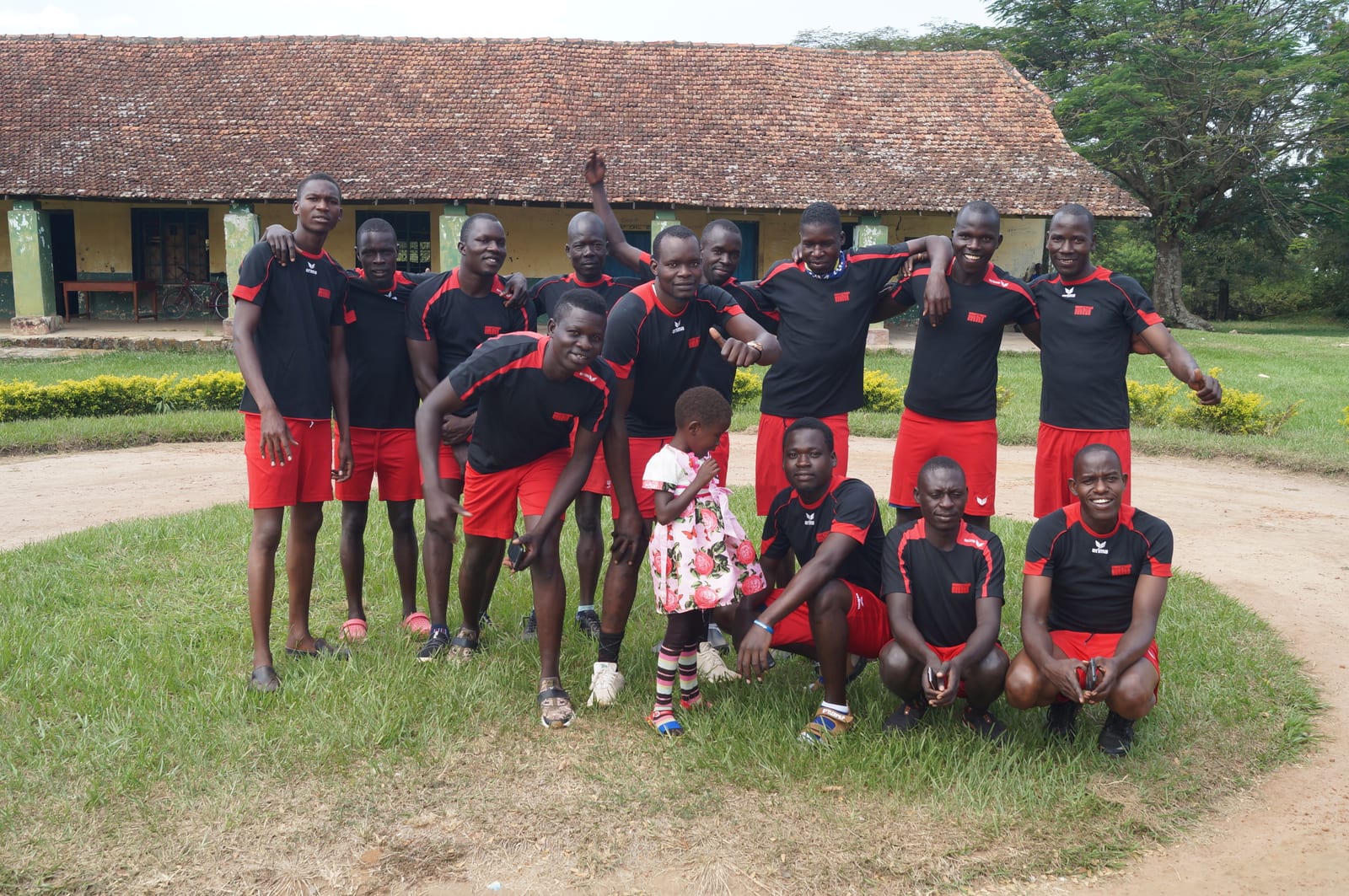 The football team in front of the school