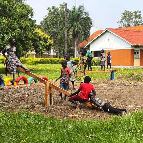 Children on the home-made seesaw
